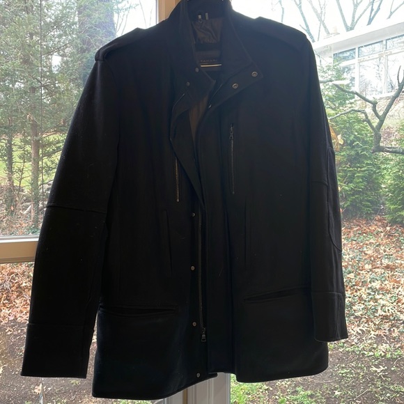 black wool/nylon coat. 8 pockets lining is polyester.